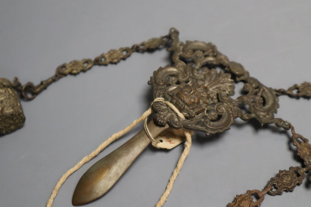 A Victorian embossed metal chatelaine, with seven attached domestic accessories, height 36cm